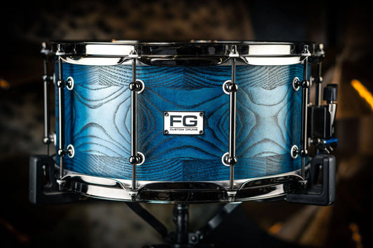 a snare drum with blue finish