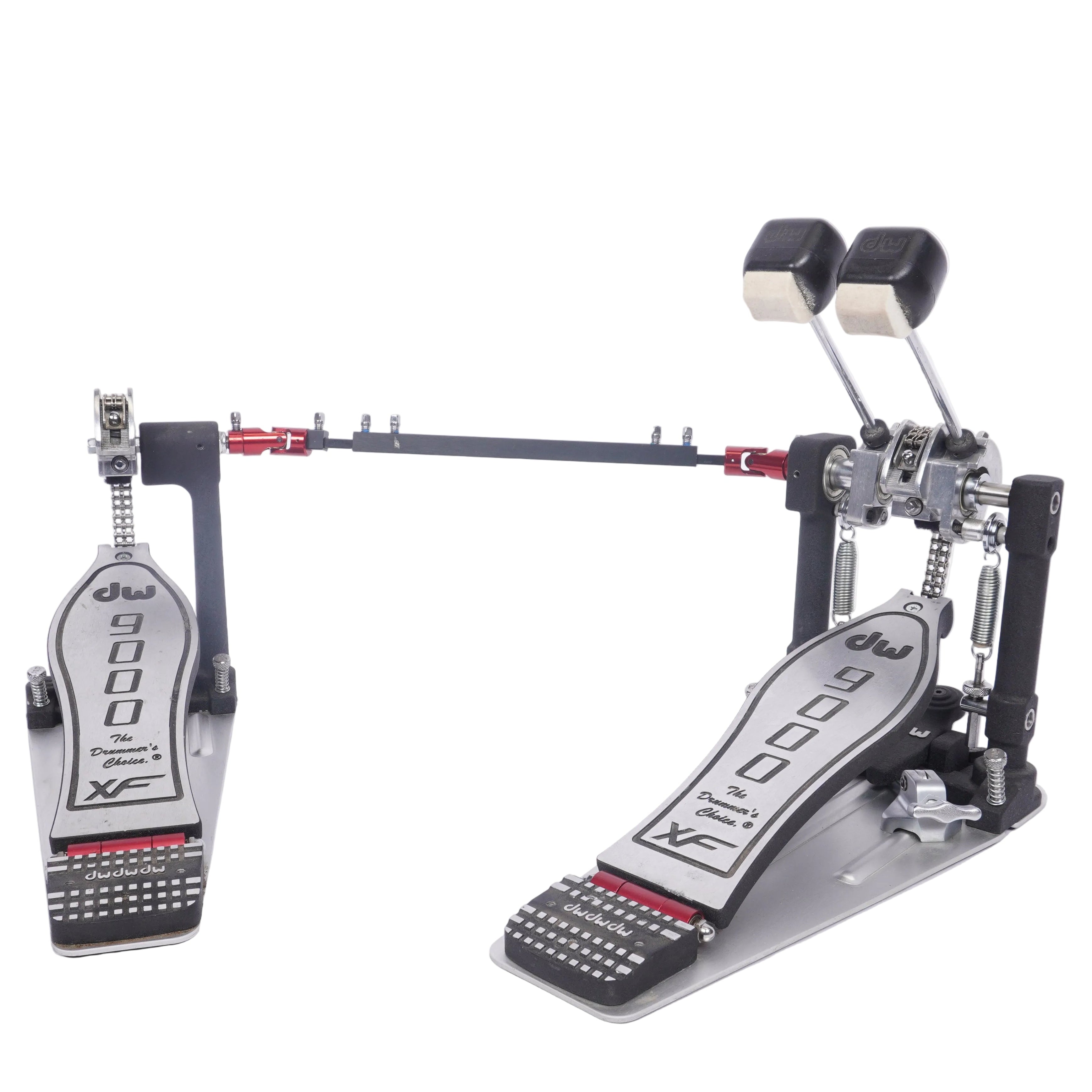 A double bass drum pedal with two metal footbeds, black double heads, and red adjustment accents, photographed on a plain white studio background.