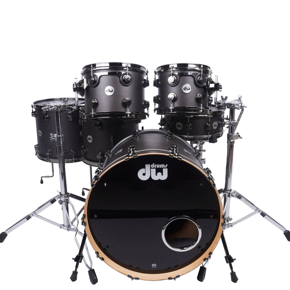 A DW drum kit with a black gloss finish and natural wood rims, displayed on a white studio background.
