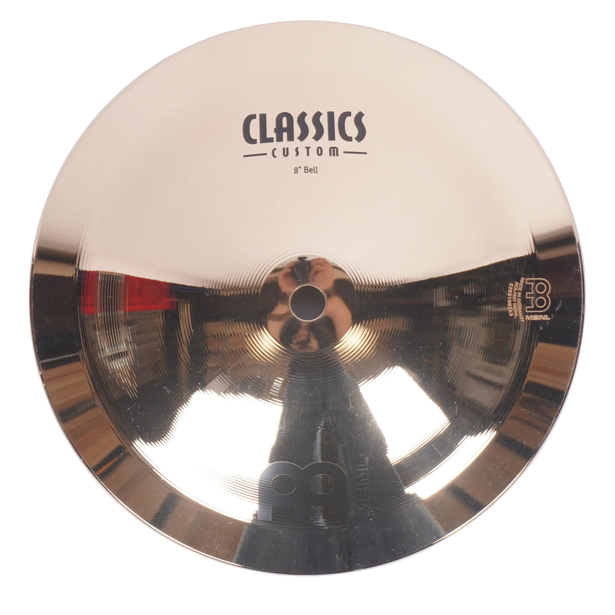 A 9-inch Meindl Classics Custom hi-hat cymbal, featuring a polished gold-toned metallic finish with a reflective surface and black printed branding.