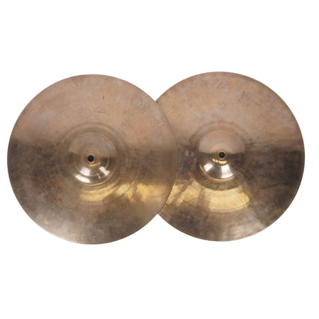 Two round brass cymbals with a warm gold and bronze metallic finish, photographed from above on a plain off-white background.