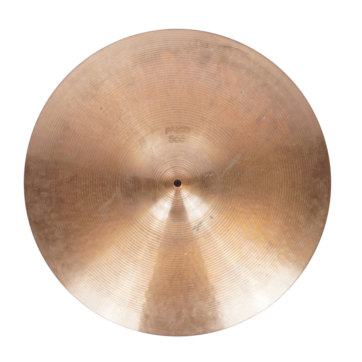 A single round brass or bronze cymbal photographed from above on a plain light background.