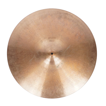 A single round brass or bronze cymbal photographed from above on a plain light background.