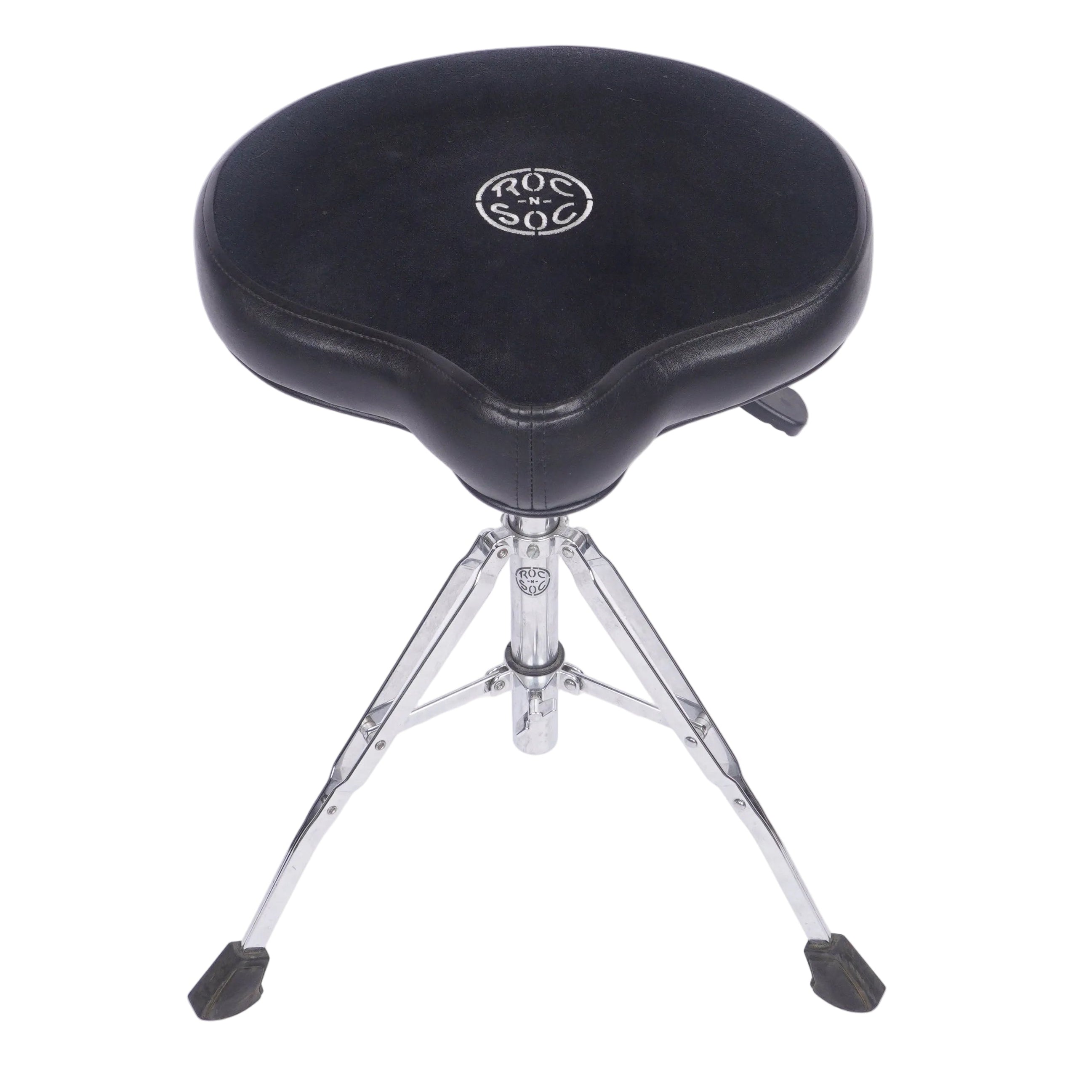 A black drum throne seat with a silver metal tripod base, featuring a circular silver logo on the center of the cushion, photographed against a white studio background.