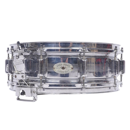 A chrome-plated metal snare drum with a silver shell and matching hardware, photographed against a plain white background.