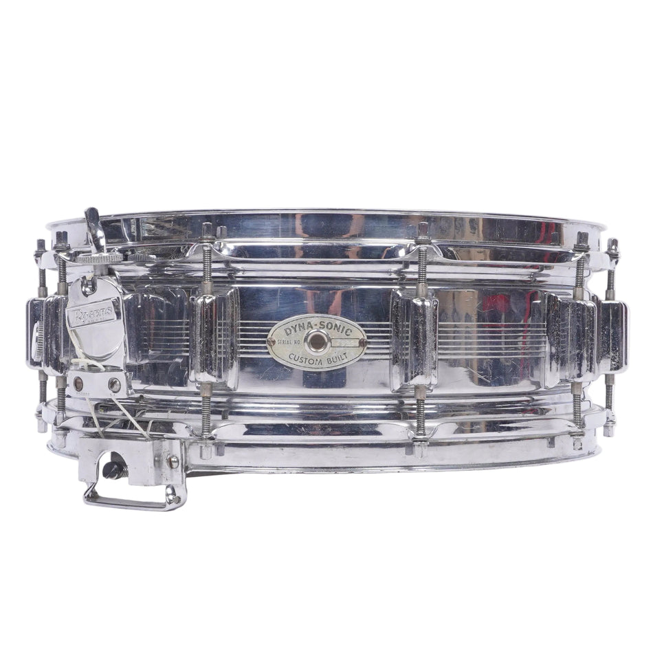 A chrome-plated metal snare drum with a silver shell and matching hardware, photographed against a plain white background.