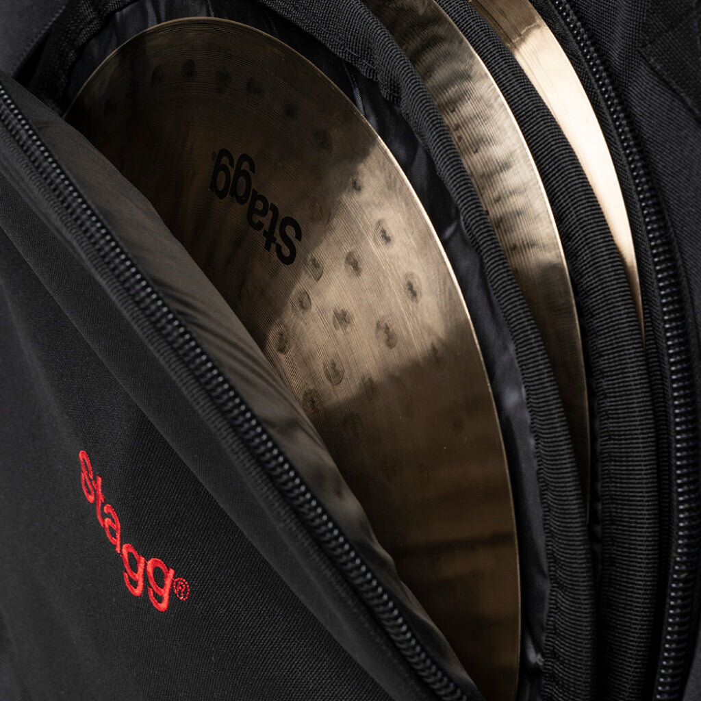 Cymbals in a Stagg case with visible branding.