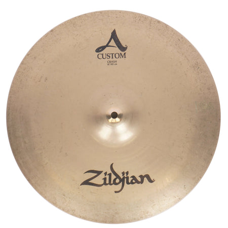 A Zildjian Custom A 16" crash cymbal with a warm gold-bronze metallic finish, featuring the Zildjian logo at the bottom and the Custom A 16" text at the top, shown against a light textured background.