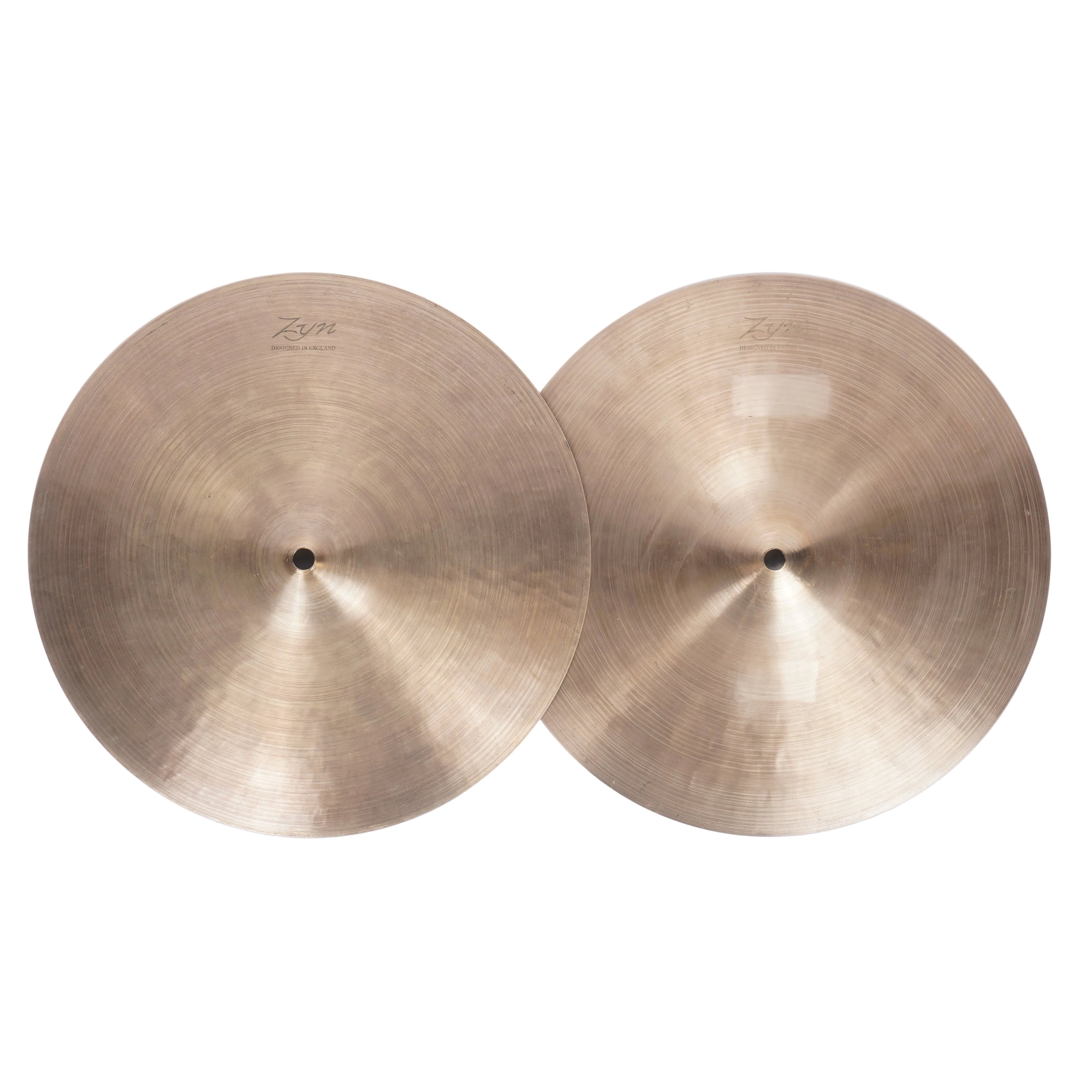 Two Zildjian ZR16 cymbals with a warm gold-bronze finish, displayed side-by-side on a light off-white background.